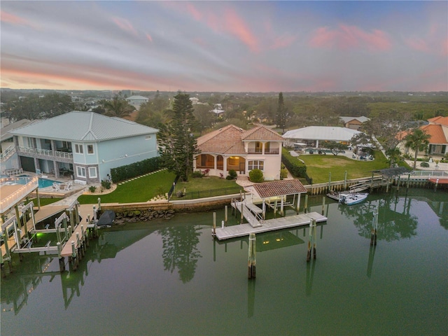 aerial view at dusk with a water view