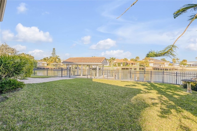 view of yard with a patio area and a water view