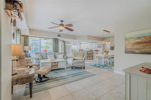 living room with light tile patterned floors and ceiling fan