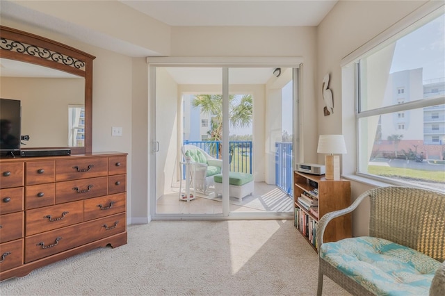 interior space featuring light colored carpet