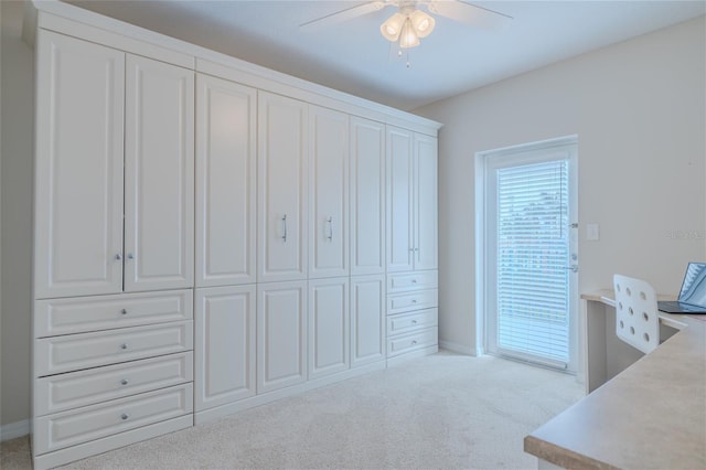 office area with light carpet and ceiling fan