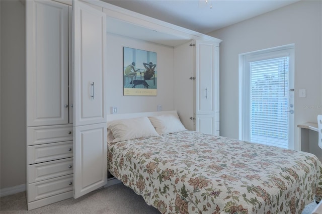 bedroom with light colored carpet