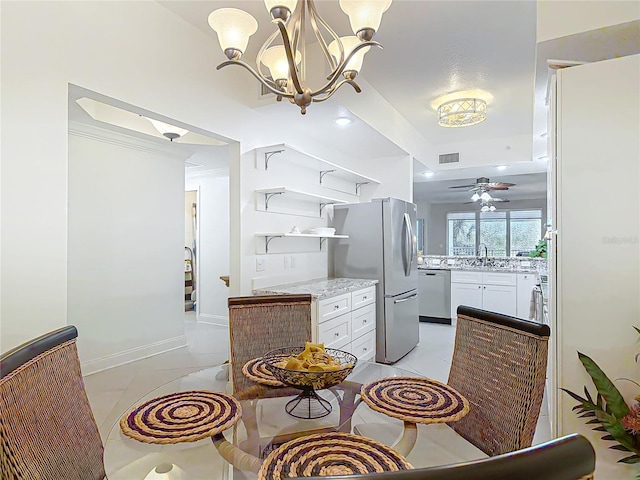 dining room with baseboards, visible vents, a ceiling fan, and light tile patterned flooring