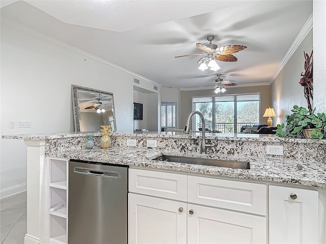 kitchen with a sink, light stone countertops, crown molding, and dishwasher