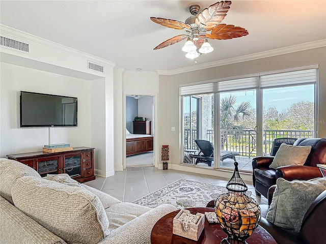 living area featuring ornamental molding, light tile patterned flooring, visible vents, and baseboards