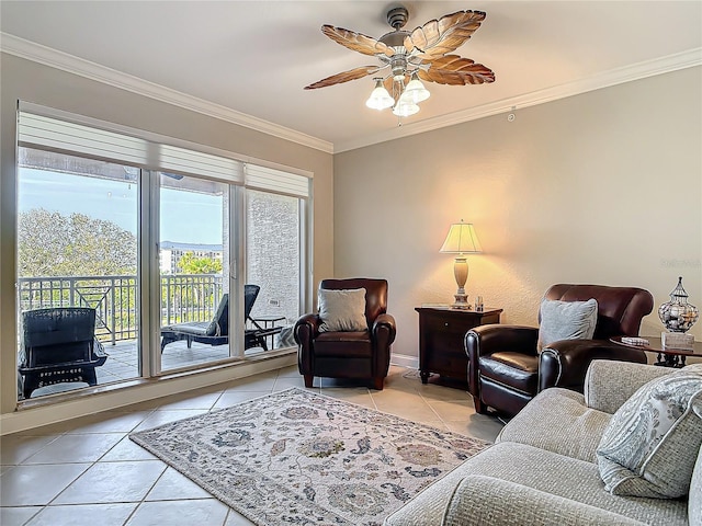 living area featuring light tile patterned floors, ceiling fan, ornamental molding, and baseboards