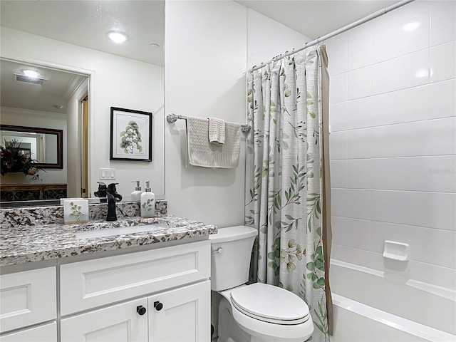 full bath featuring shower / bath combo, vanity, and toilet