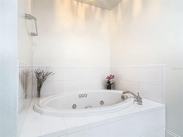 full bathroom featuring a whirlpool tub