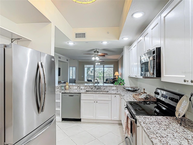 kitchen with light tile patterned floors, a sink, visible vents, white cabinetry, and appliances with stainless steel finishes