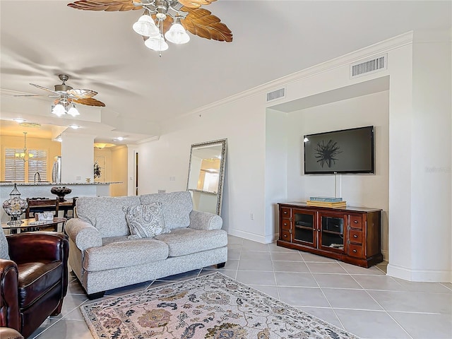 living room featuring light tile patterned floors, crown molding, visible vents, and a ceiling fan