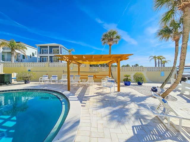 view of pool featuring a pergola and a patio area