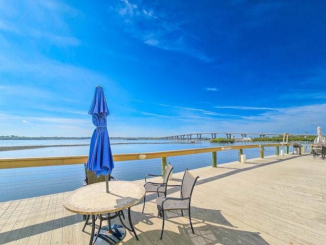 dock area with a deck with water view