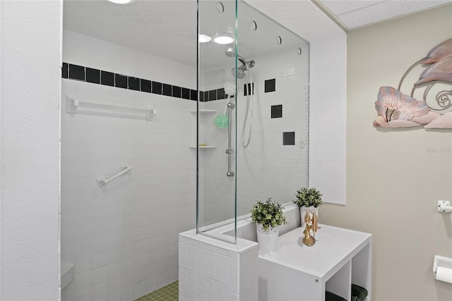 bathroom with tiled shower