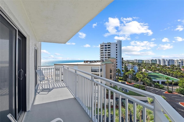 balcony featuring a water view