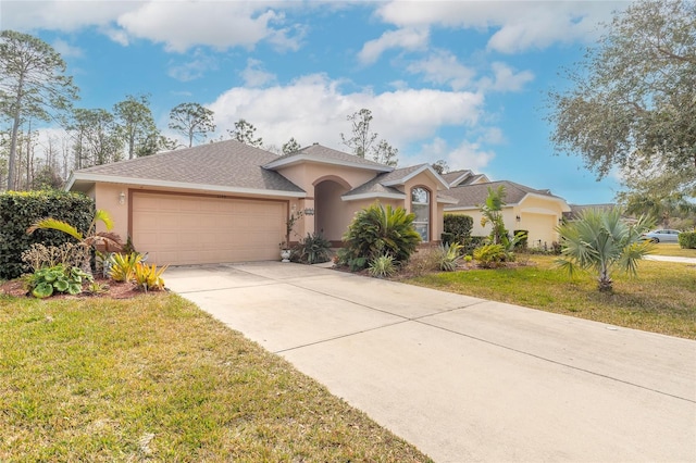 view of front facade with a garage and a front yard