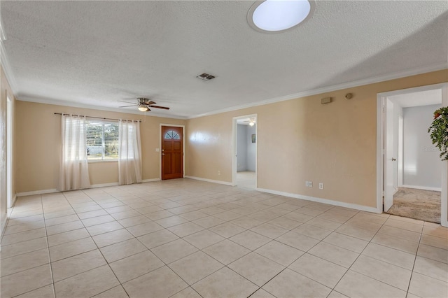 tiled empty room featuring ornamental molding, a textured ceiling, and ceiling fan