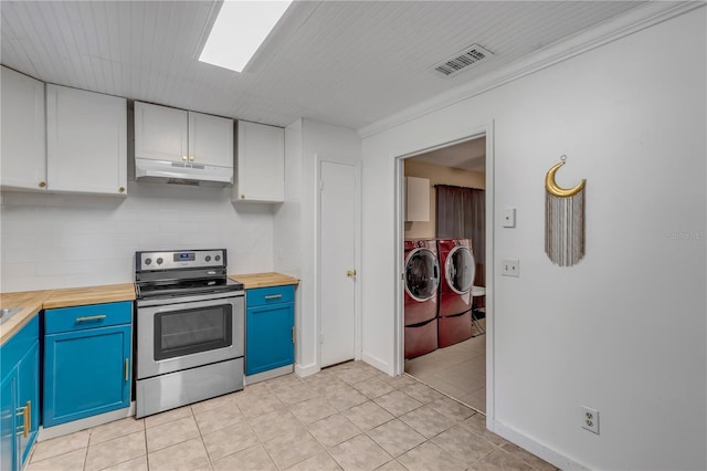 kitchen featuring butcher block counters, electric range, blue cabinets, washing machine and clothes dryer, and white cabinets