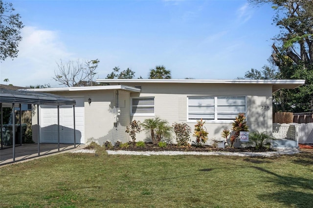 view of front of house with a garage and a front yard