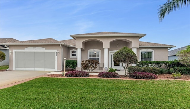 view of front facade featuring a garage and a front yard