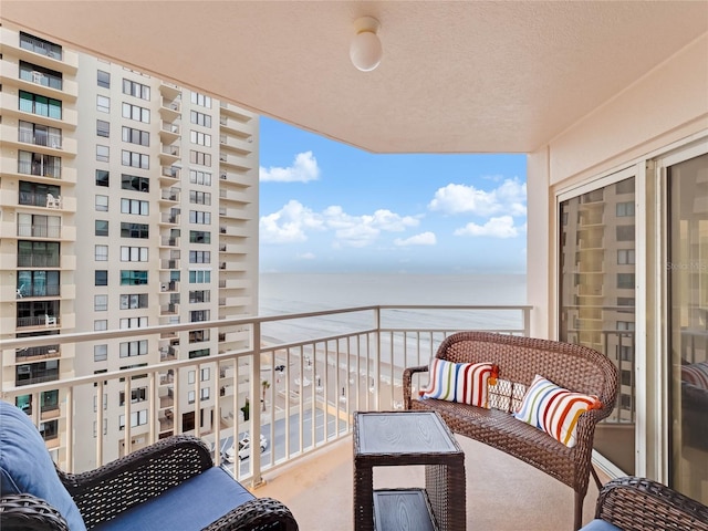 balcony featuring a water view