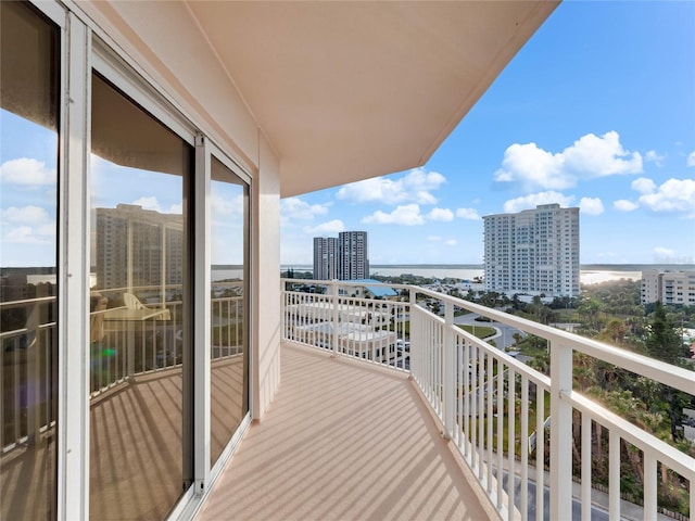 balcony featuring a water view