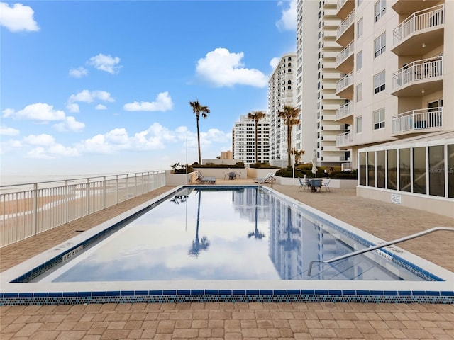 view of pool featuring a patio area