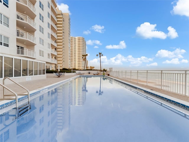 view of swimming pool featuring a patio area