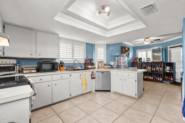 kitchen featuring light tile patterned flooring, sink, white cabinetry, stainless steel dishwasher, and a tray ceiling