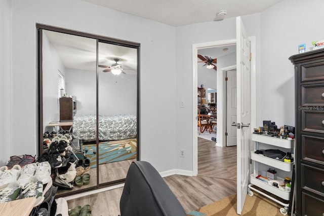 interior space featuring hardwood / wood-style flooring and ceiling fan