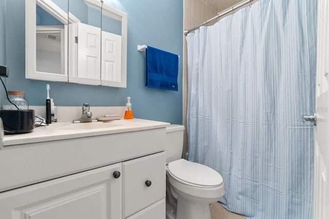 bathroom with vanity, toilet, and a shower with shower curtain