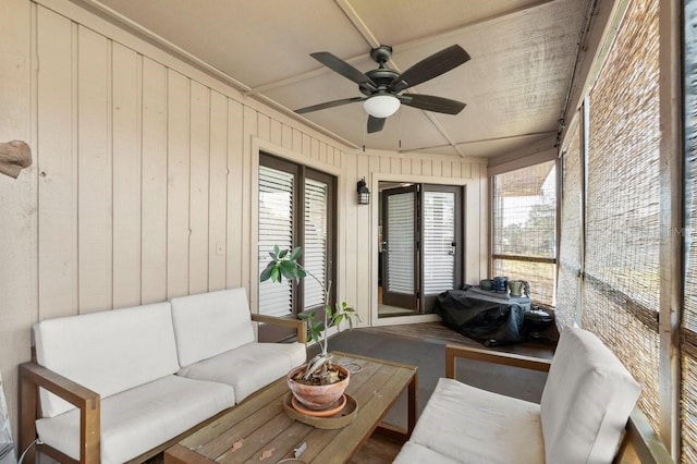 sunroom featuring a healthy amount of sunlight and ceiling fan