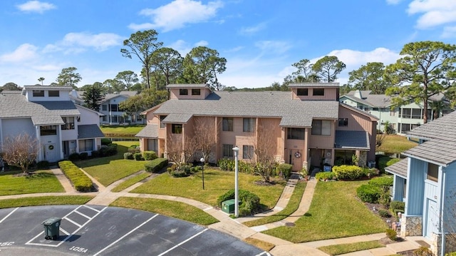 exterior space featuring a front lawn