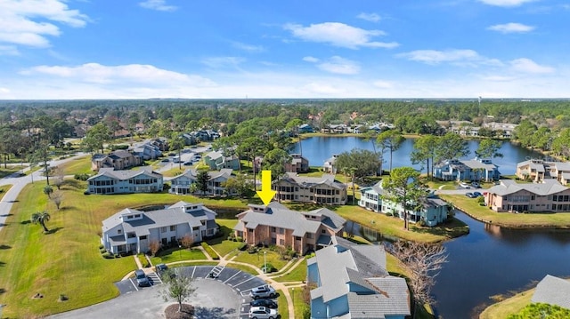 birds eye view of property with a water view