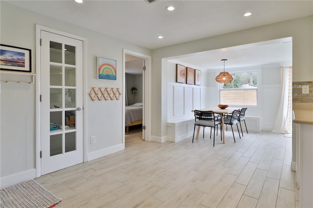 dining space with light wood-type flooring