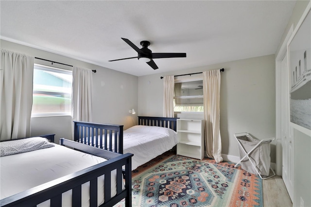 bedroom featuring ceiling fan and light hardwood / wood-style flooring