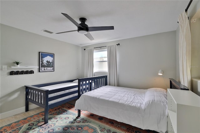 bedroom featuring ceiling fan and wood-type flooring