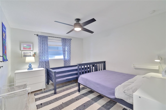 bedroom featuring ceiling fan and light hardwood / wood-style floors