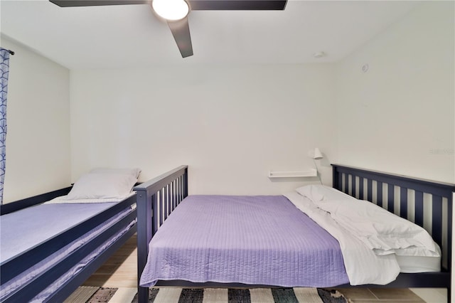 bedroom featuring hardwood / wood-style flooring and ceiling fan