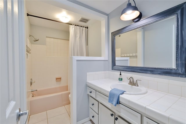 full bathroom with tile patterned floors, vanity, toilet, and shower / tub combo