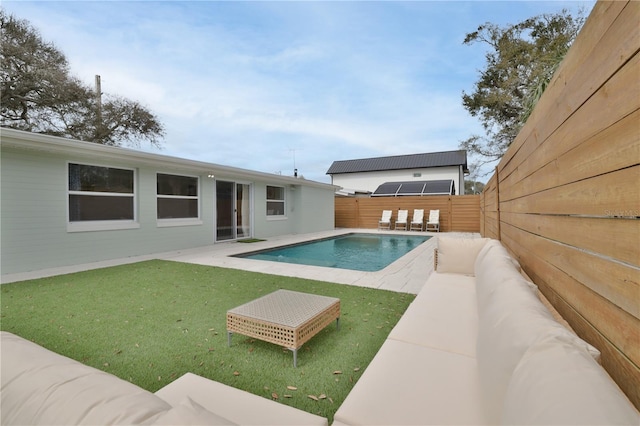 view of pool with a yard and a patio