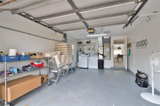 garage featuring a garage door opener and washer and clothes dryer