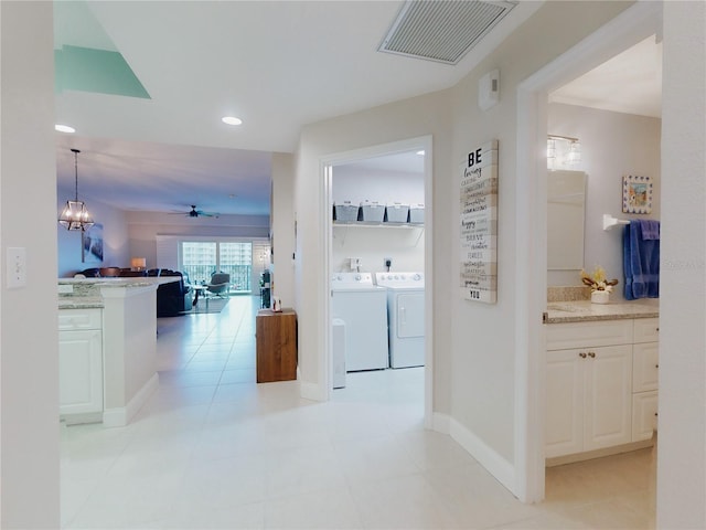 hallway featuring separate washer and dryer