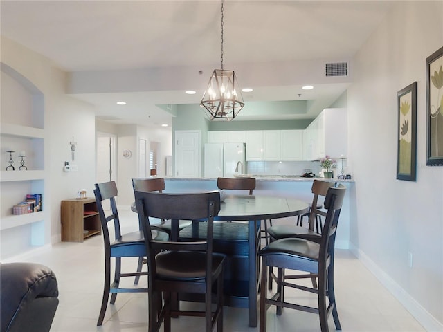 dining area featuring sink and built in shelves