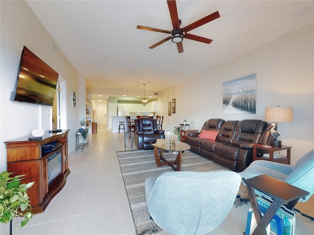 tiled living room featuring ceiling fan