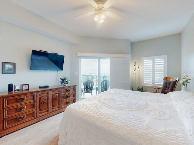 bedroom featuring access to exterior, ceiling fan, and light hardwood / wood-style flooring