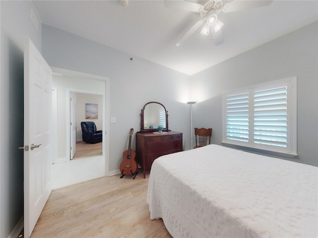 bedroom with light hardwood / wood-style floors and ceiling fan