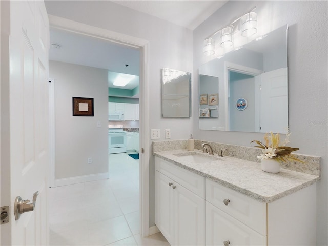 bathroom with vanity and tile patterned flooring