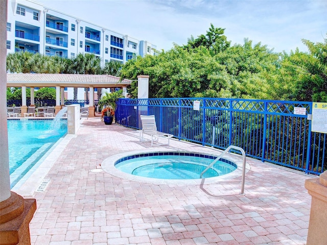 view of pool featuring a community hot tub