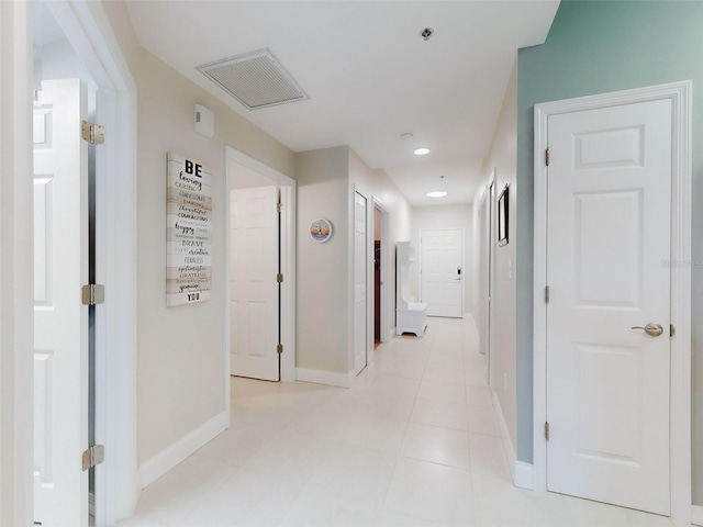 5300 S Atlantic Ave Unit 3-504, New Smyrna Beach, FL 32169 - corridor featuring light tile patterned floors, baseboards, recessed lighting, and visible vents