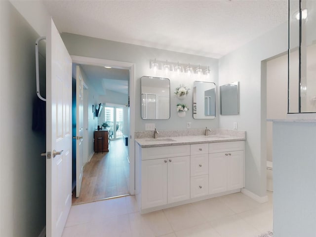 5300 S Atlantic Ave Unit 3-504, New Smyrna Beach, FL 32169 - full bath with double vanity, a sink, baseboards, and toilet
